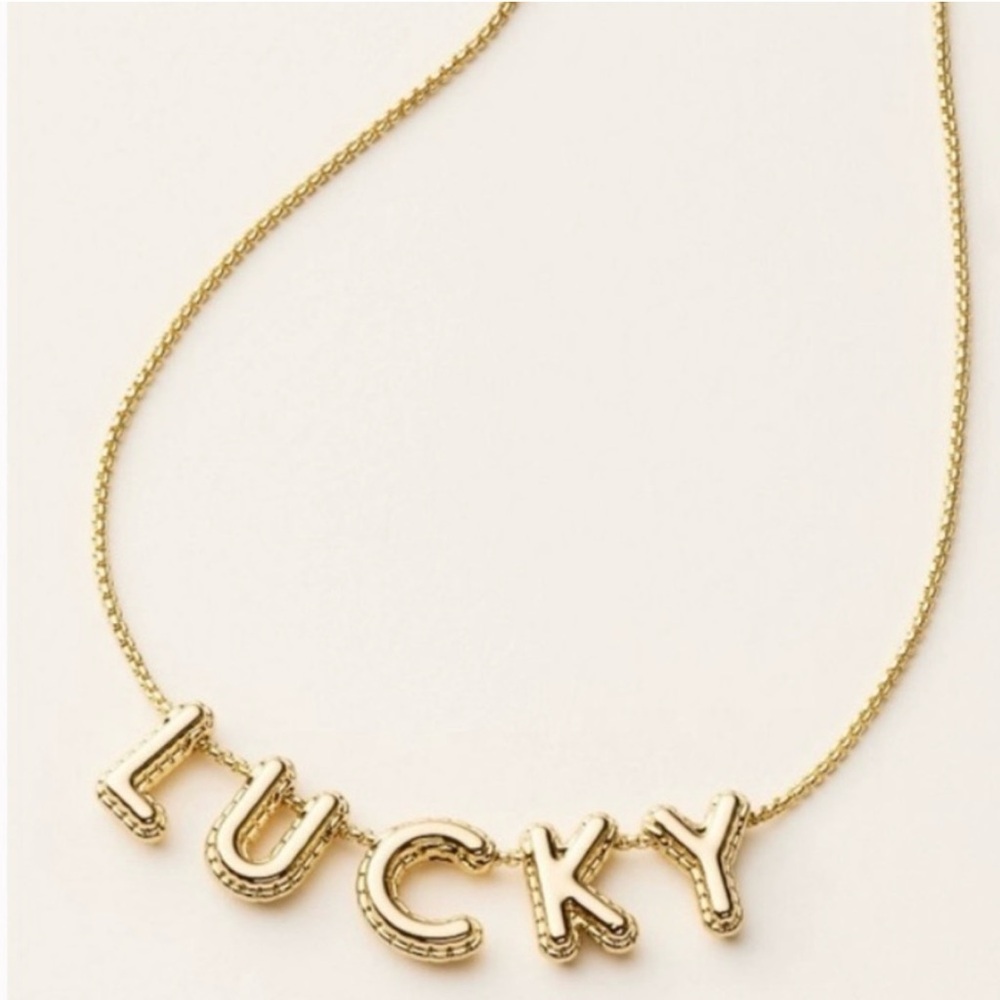 Gold kate spade ‘Lucky' Necklace